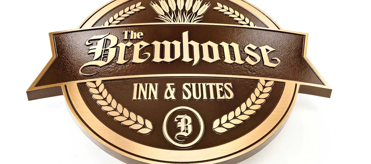 Commercial exterior sign for The Brewhouse Inn and Suites with wheat details