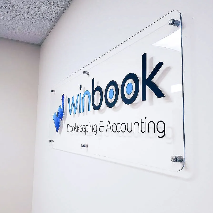 Commercial interior sign for Winbook Bookkeeping with exterior glass mounting