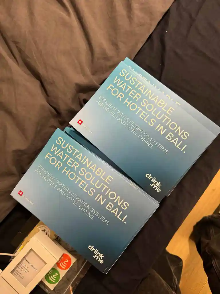 Two stacks of brochures titled 'Sustainable Water Solutions for Hotels in Bali' promoting efficient water filtration systems for hotels and hotel chains.