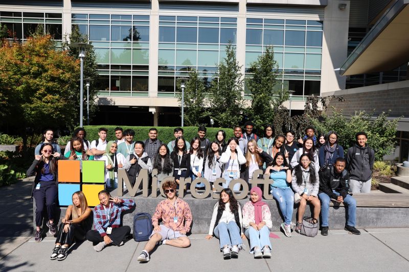 A group of students in the ront of the University.