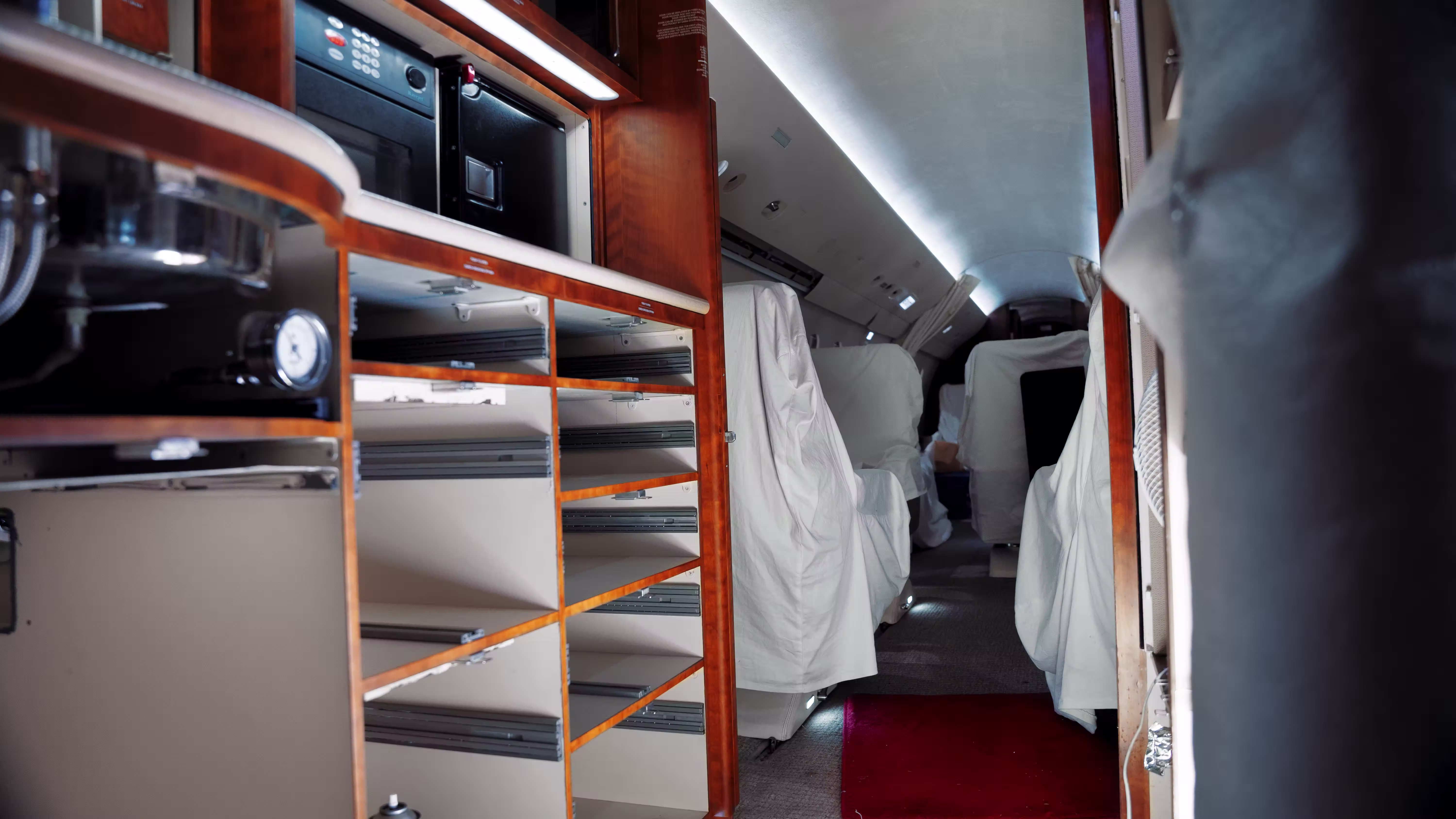 Detailed craftsmanship on aircraft cabin side panels and galley refurbishment