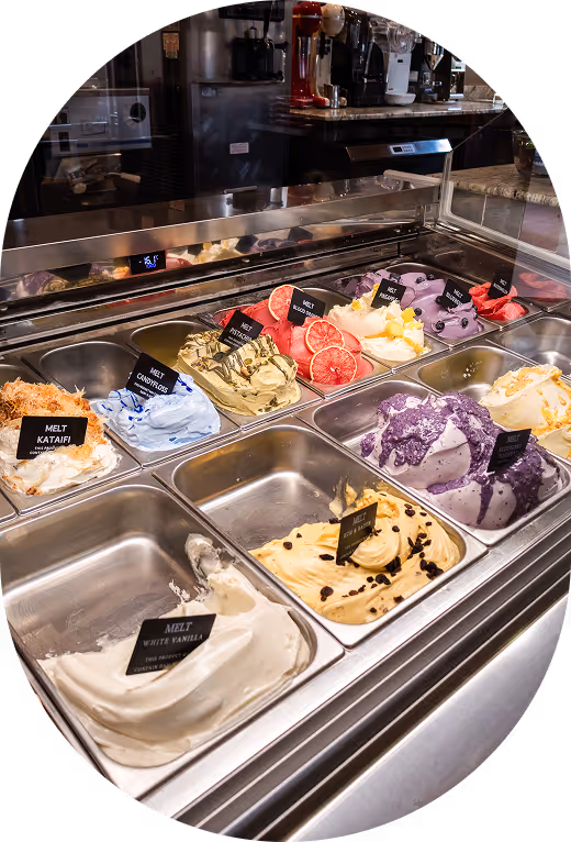 A scoop of raspberry gelato being placed into a cup at Melt.