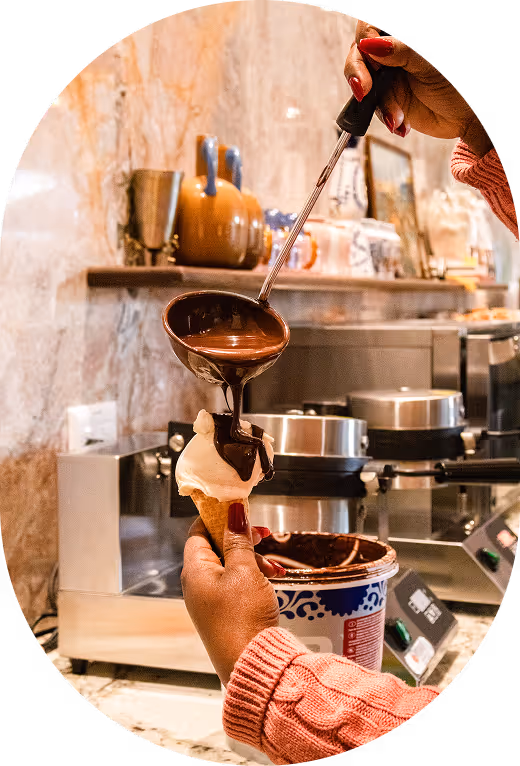 A gallery photo of friends laughing and sharing gelato at Melt.