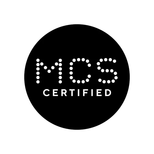 Black circular MCS certified logo with white dotted letter design
