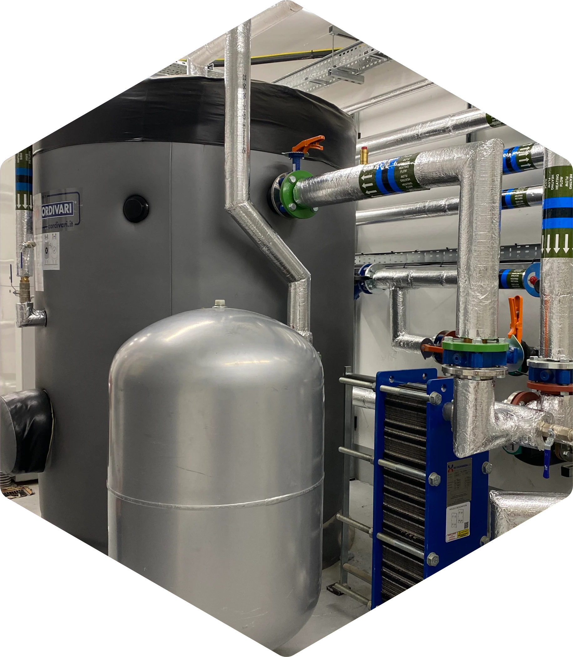 Industrial boiler system with silver tanks, pipes, and heat exchange components