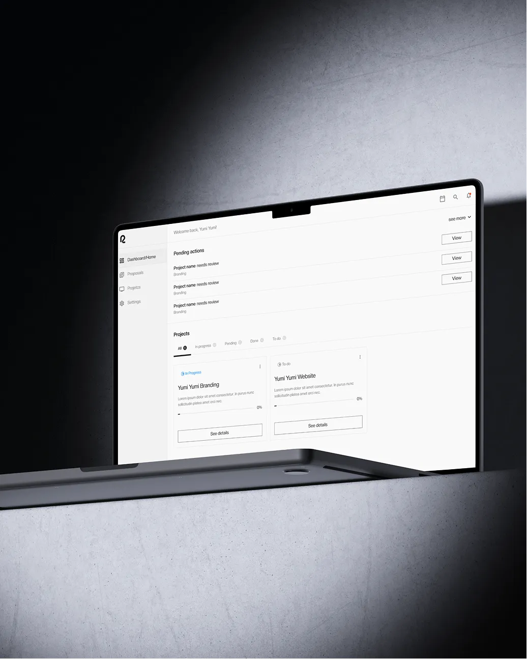 Laptop screen showing a project management dashboard with pending actions and projects listed.