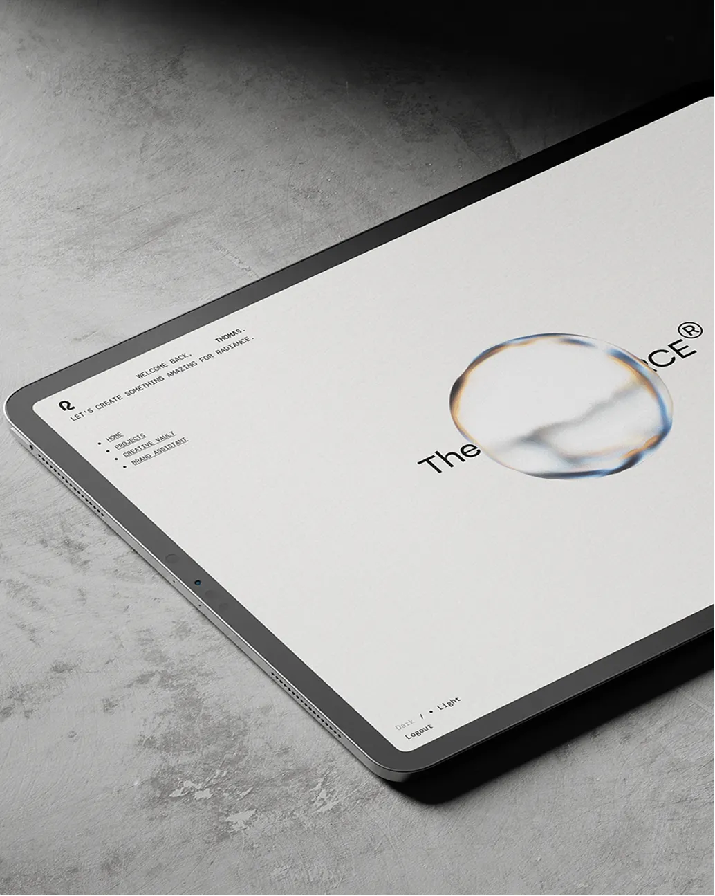Tablet displaying a welcome screen for Thomas with creative project links and a translucent circle logo.