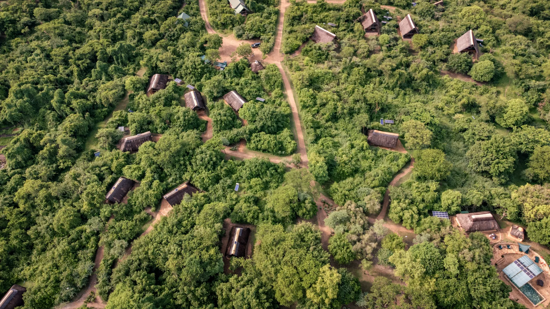Drone view of Murchison River Lodge grounds including the Thatched Safari Tents located in the bush.