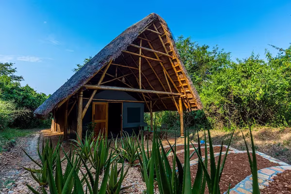 En-suite Thatched Safari Tent with veranda positioned in the lodge grounds 