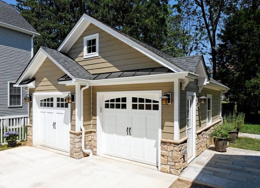 Detached garage addition with craftsman styling and stone accents