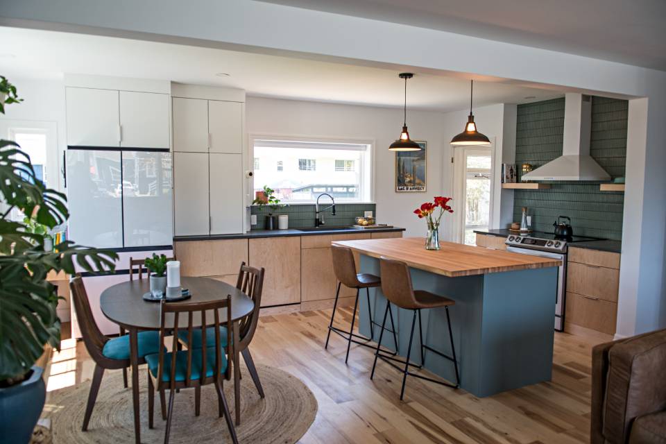 Finished kitchen renovation with a two-tone island and quartz countertops