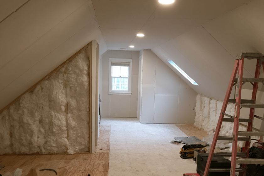 Income suite mid construction with new drywall, insulation, and a skylight opening