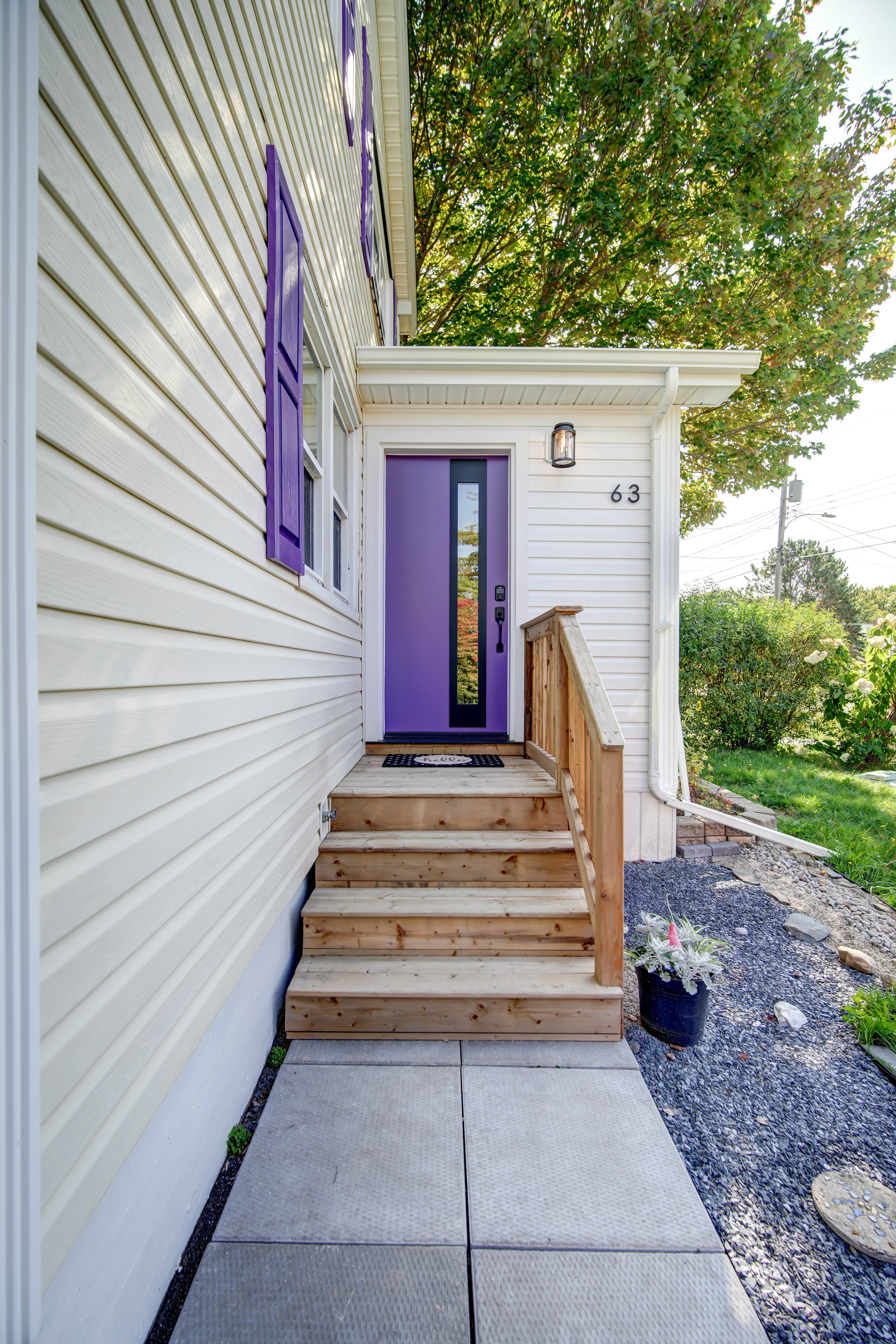 New front entry on a Dartmouth addition, with timber steps and a paver walkway