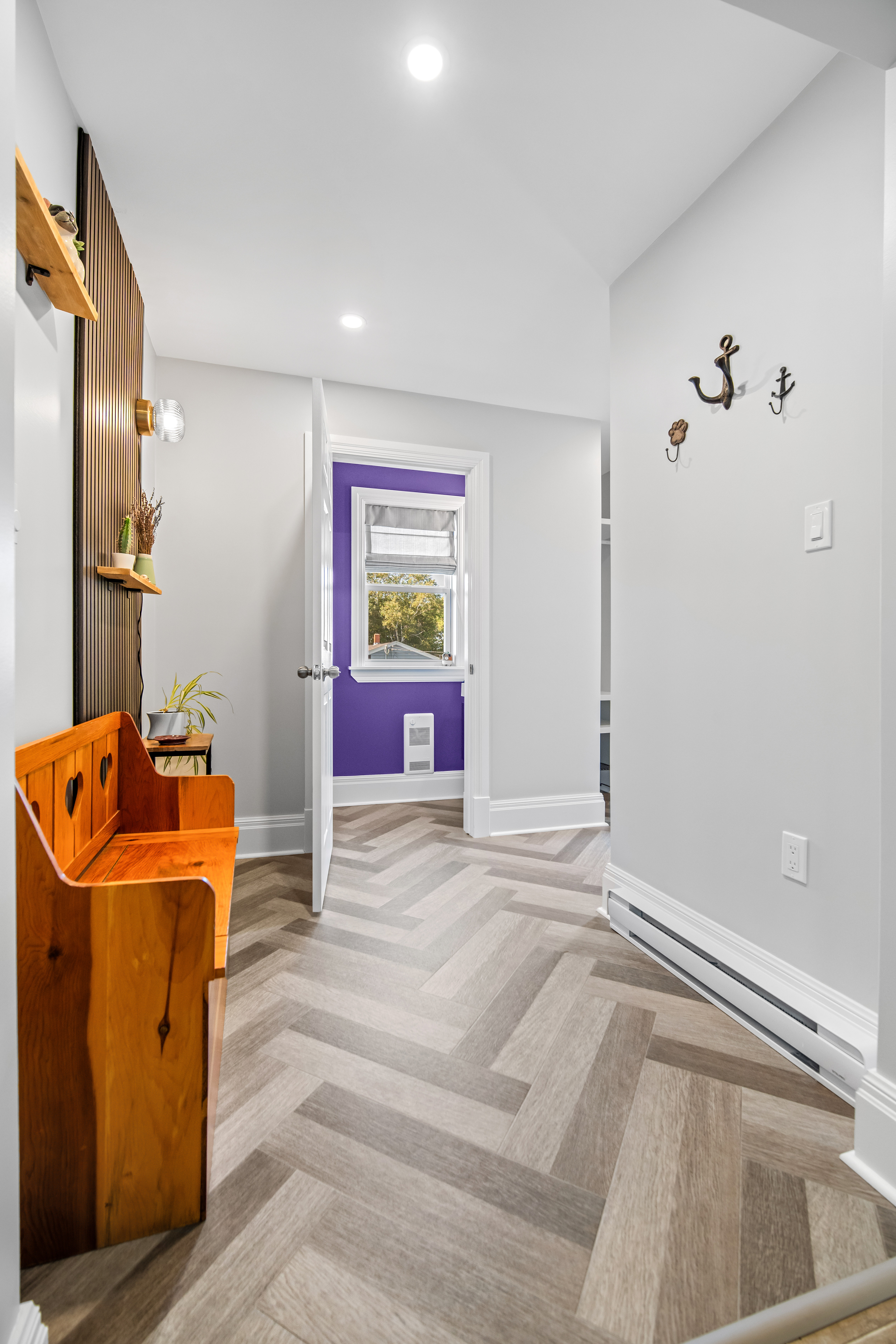 Mudroom corridor in a Dartmouth addition leading to the new front entry door