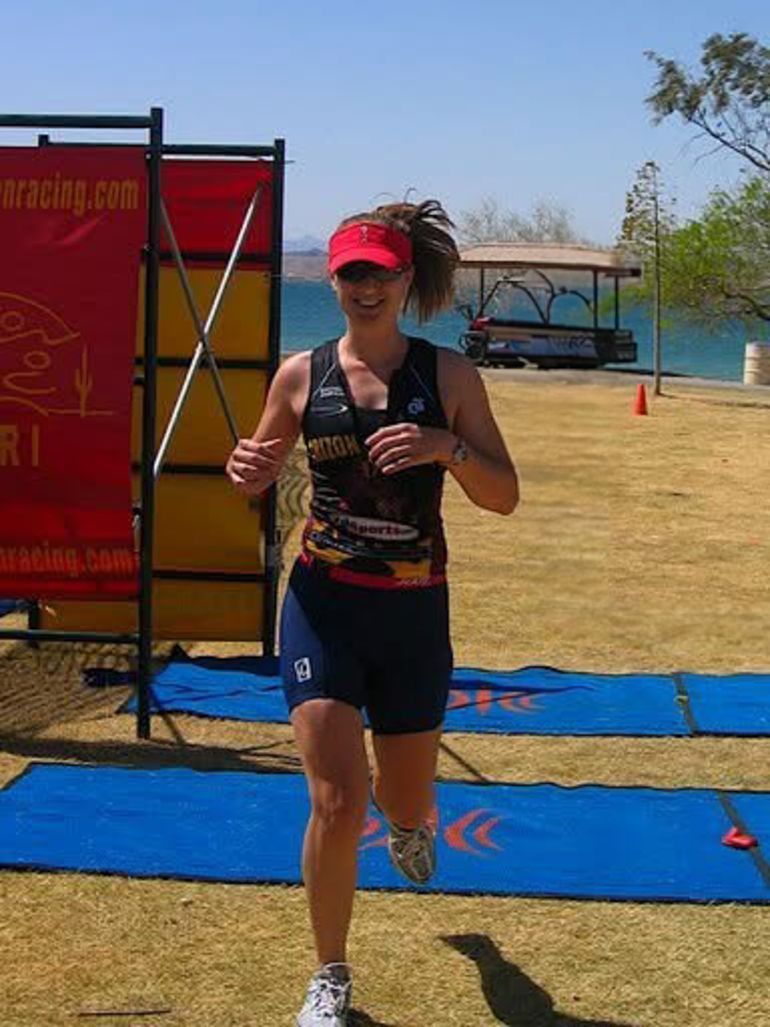 Dr. Victoria Aimé competing in the Lake Havasu collegiate triathlon race in college.