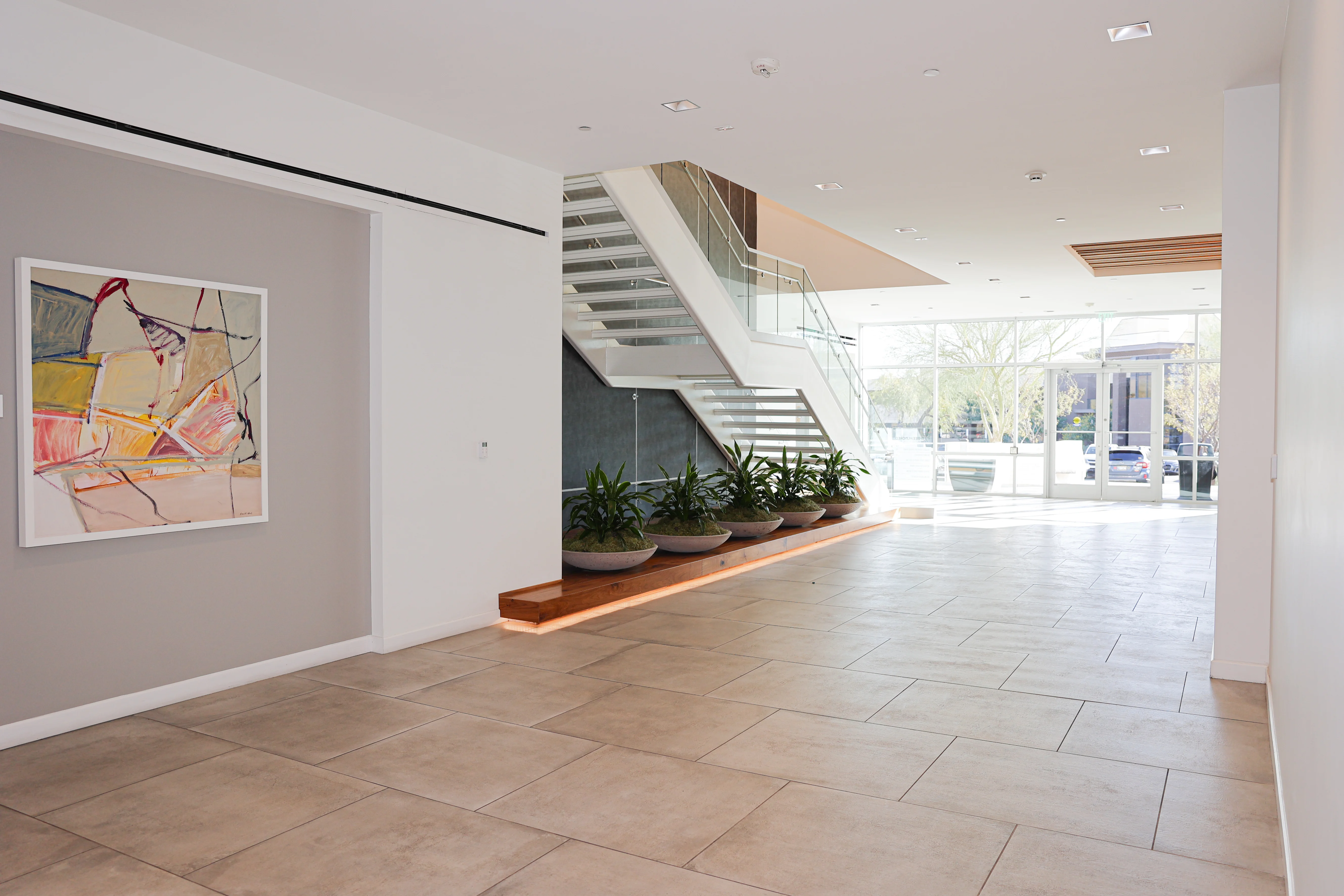 Spacious lobby with modern art and natural light in Scottsdale Arizona building that houses Metropolitan Plastic Surgery.