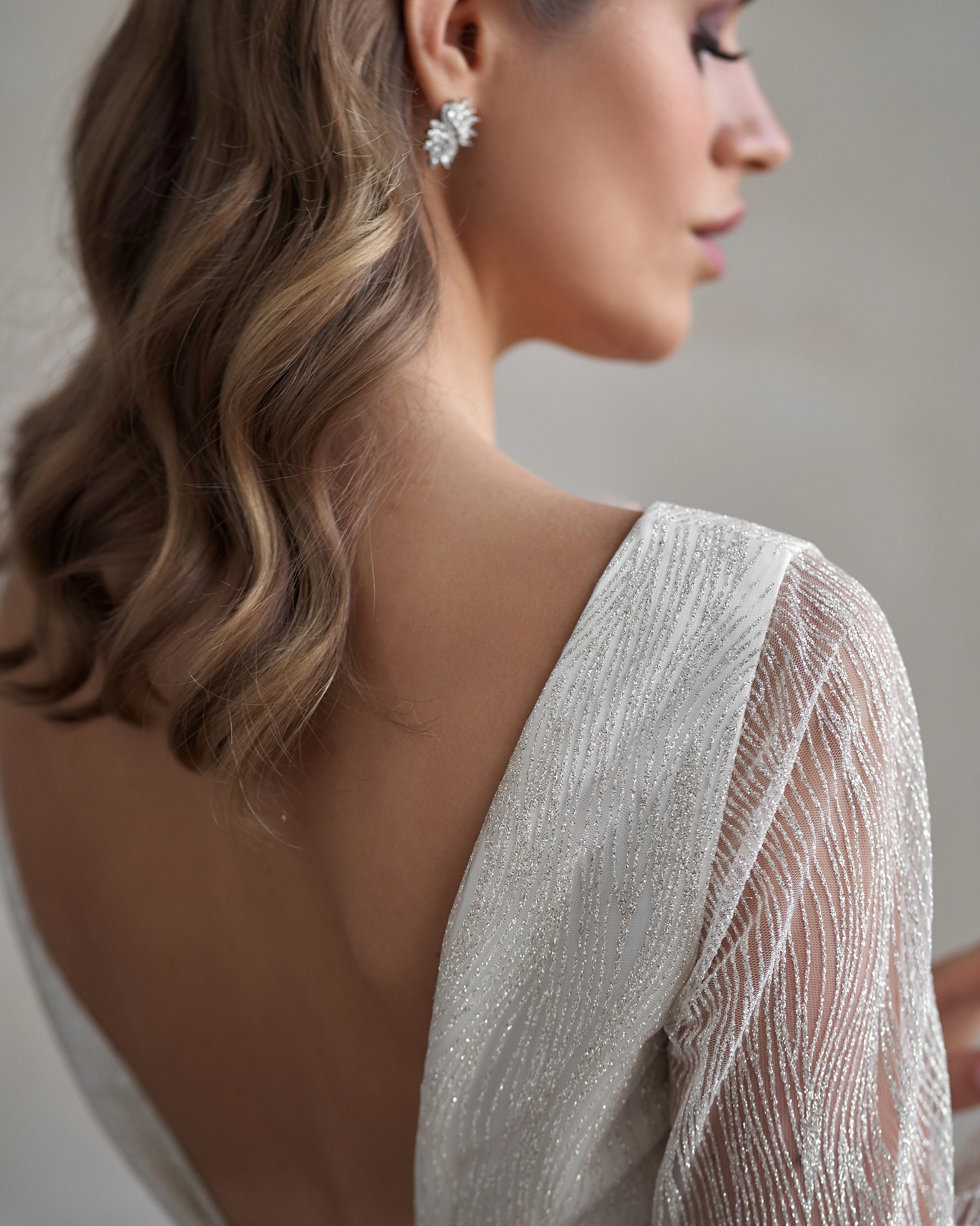 Close-up of woman’s ear and earlobe with smooth, natural contour after earlobe rejuvenation or repair
