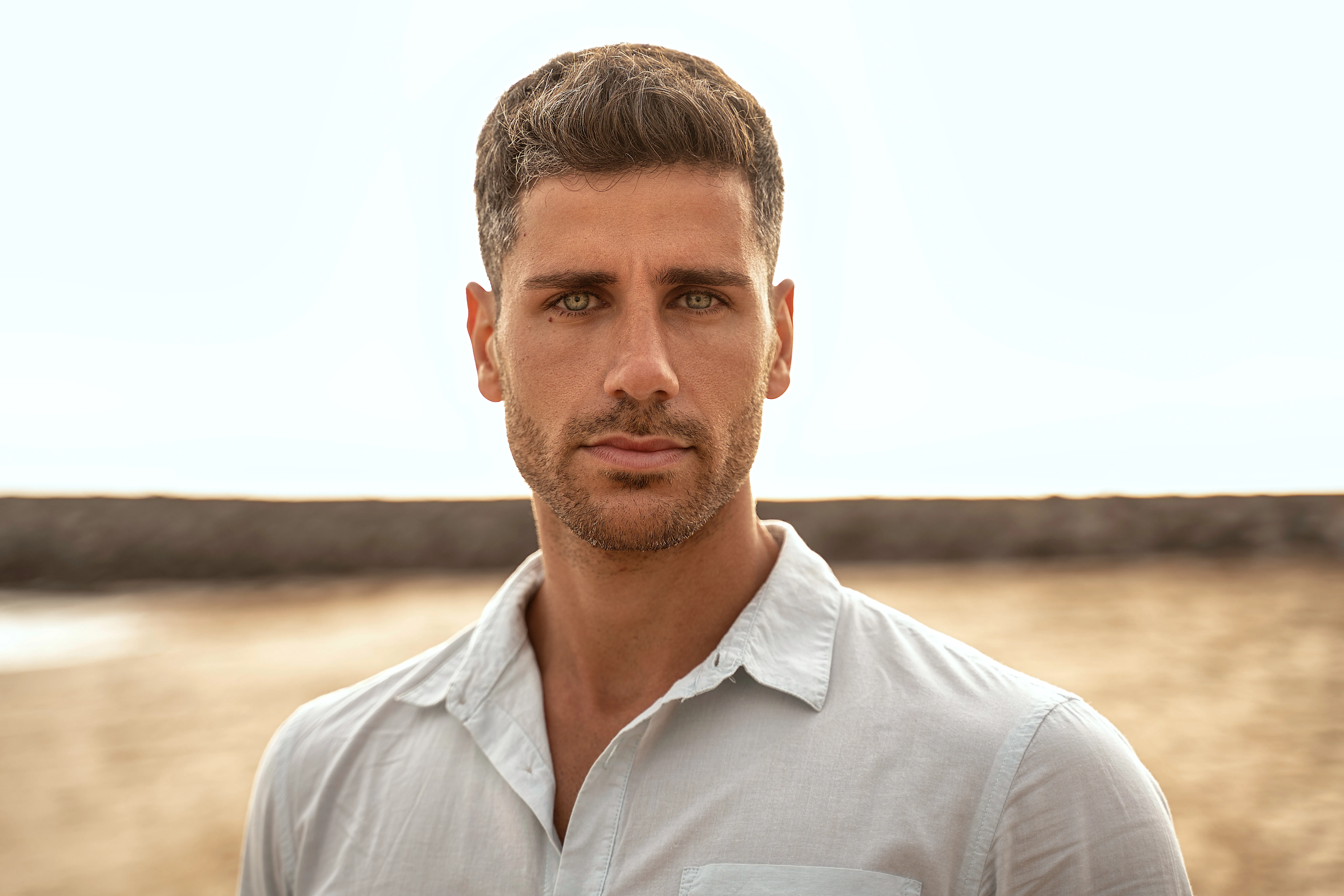 Man with smooth, youthful facial features and defined jawline representing results after male face and neck rejuvenation