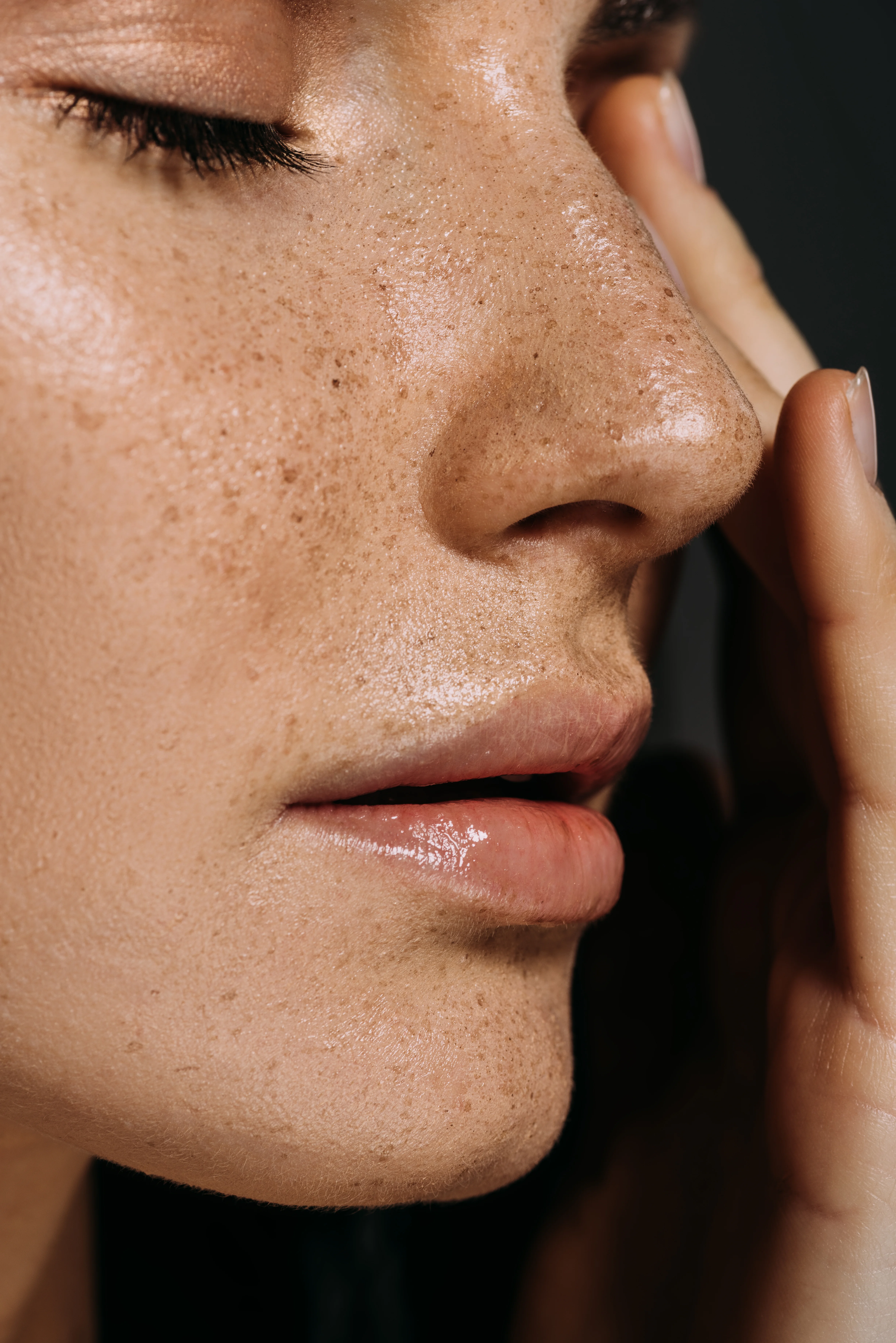Close-up profile of woman’s nose with smooth, refined contour representing results after rhinoplasty