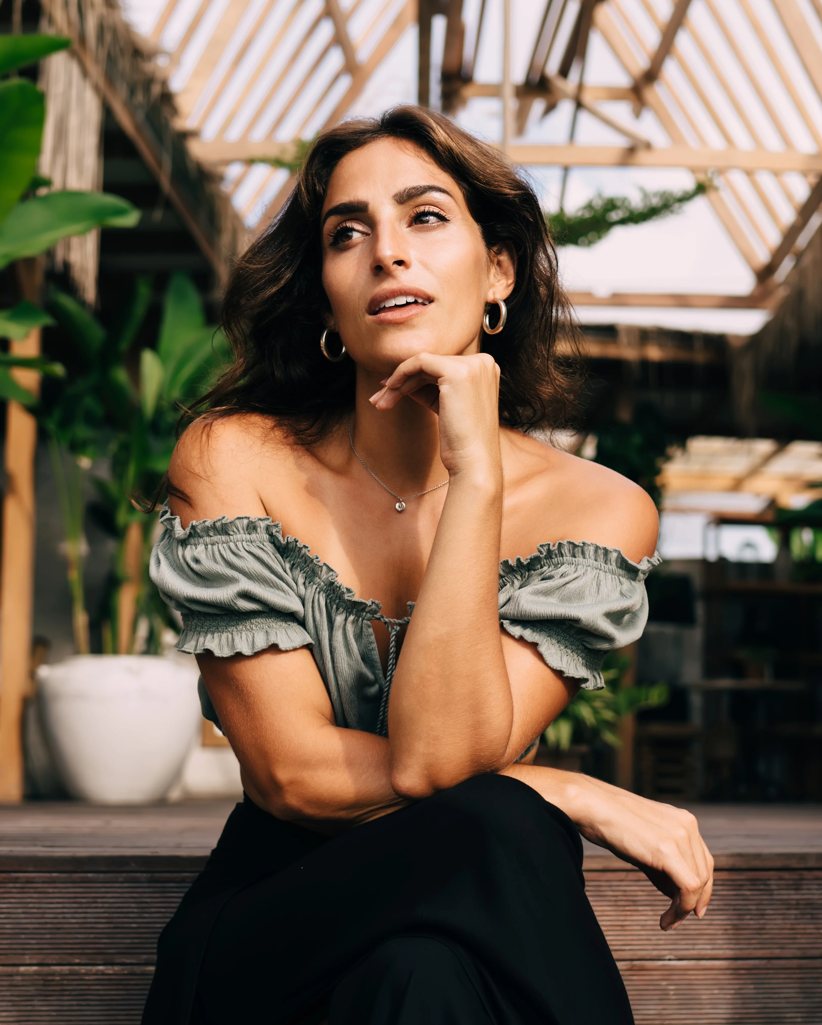 Woman with smooth, lifted facial contours and defined jawline representing natural results after facelift and neck lift surgery