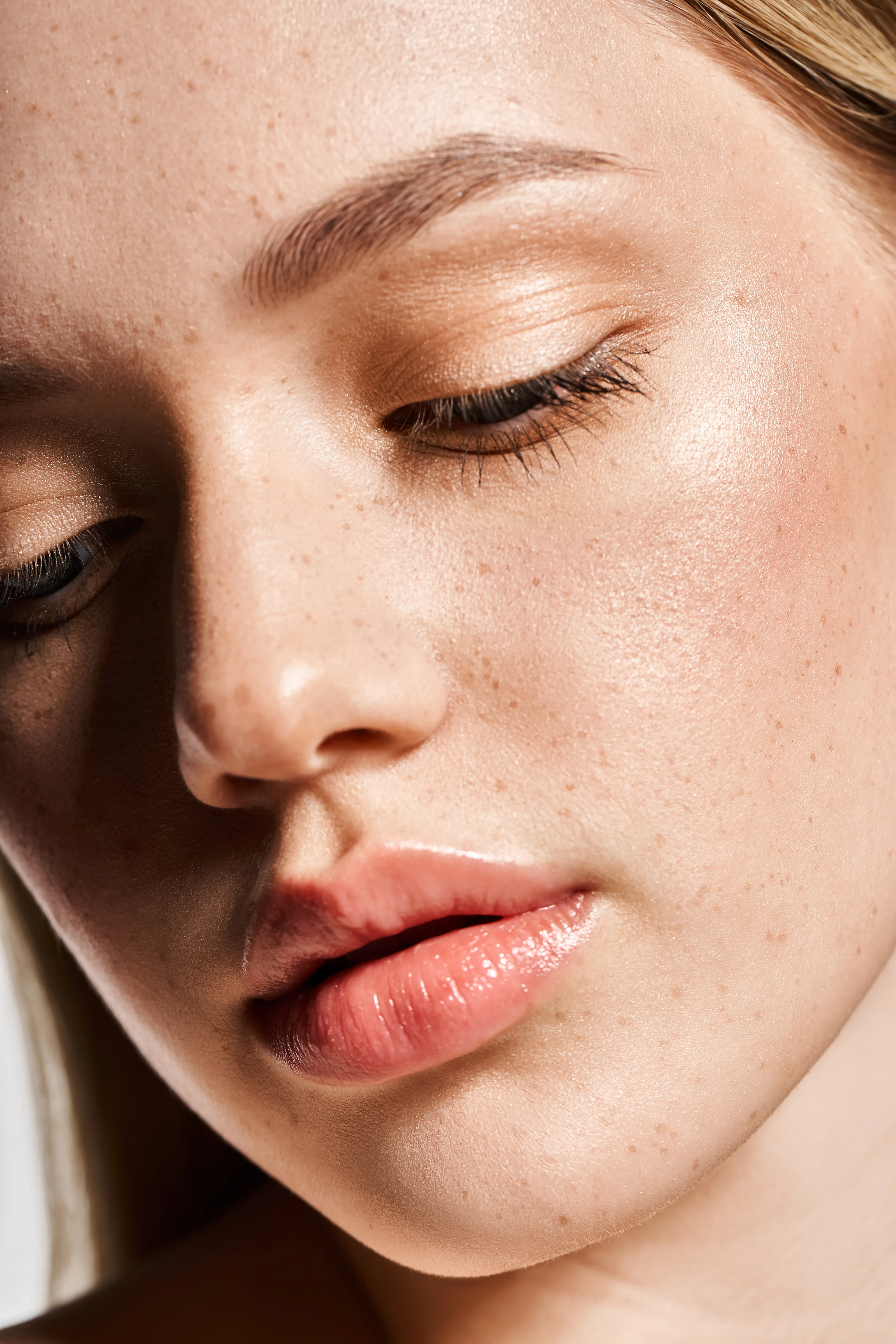 Close-up of woman’s face with smooth texture and radiant skin tone after microneedling treatment