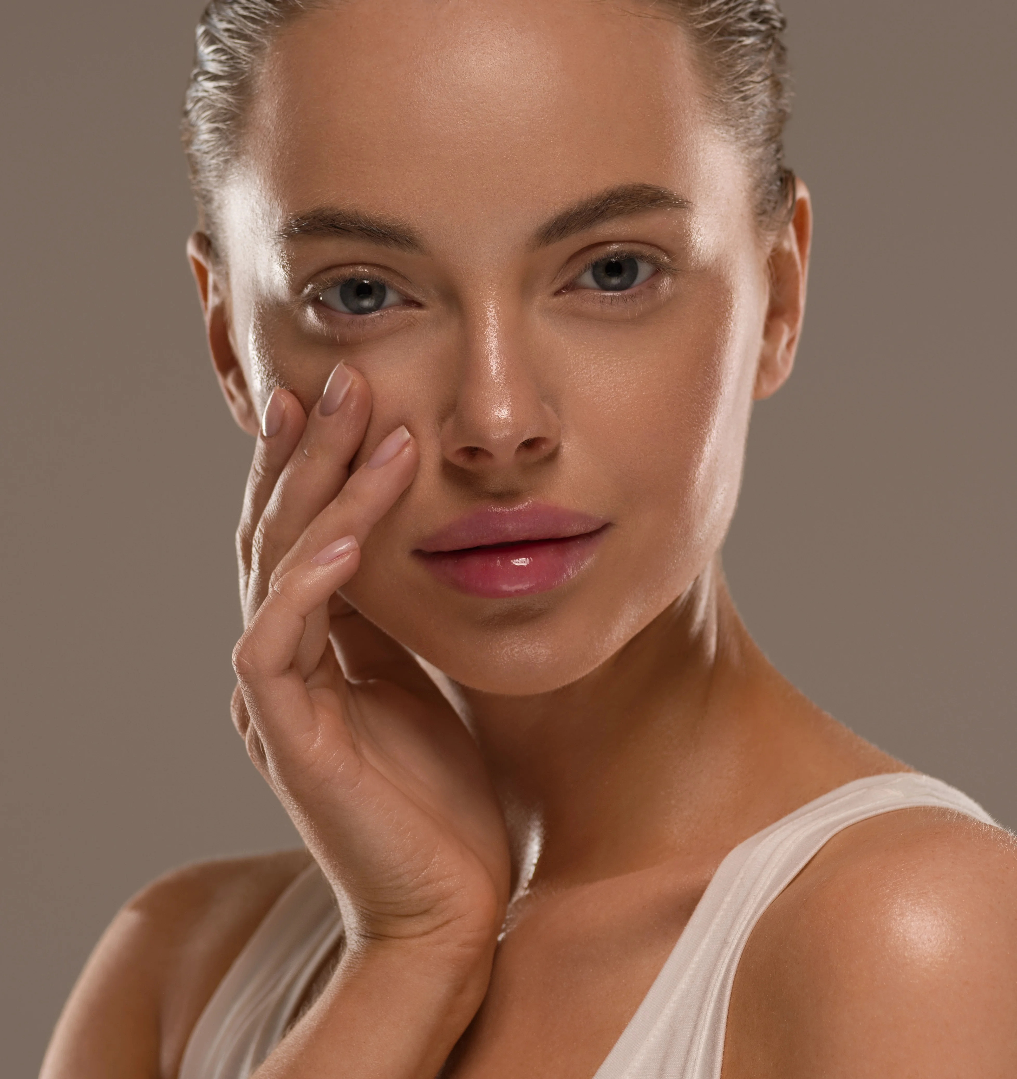 Woman with balanced facial profile and natural ear positioning representing results after otoplasty (ear pinning) surgery