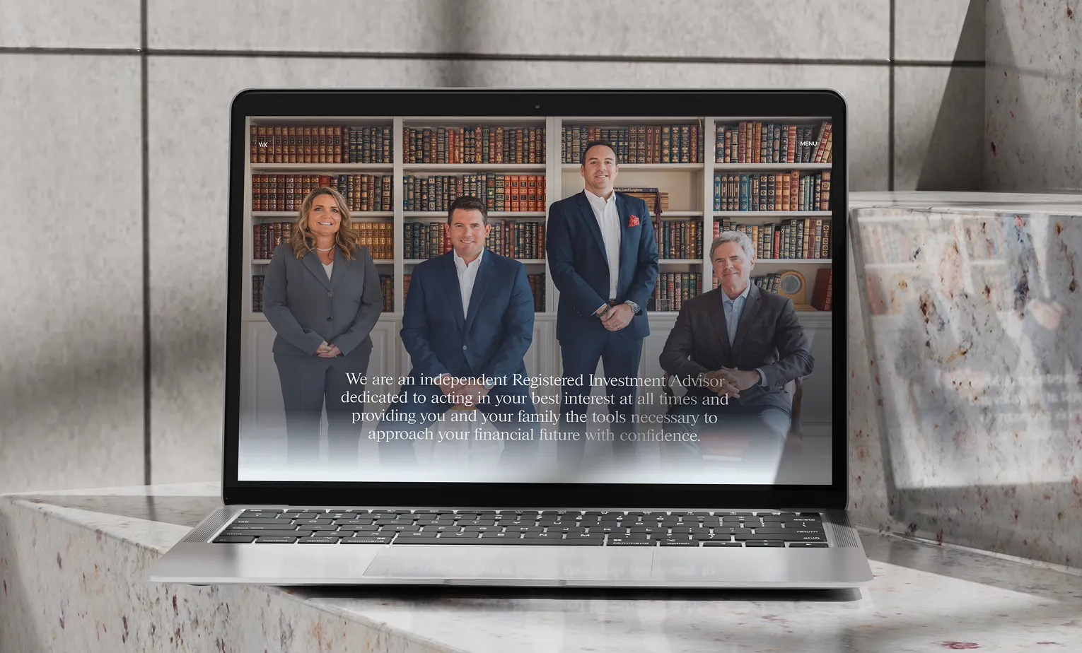 Laptop mockup of Walter & Keenan's website by J2 Marketing