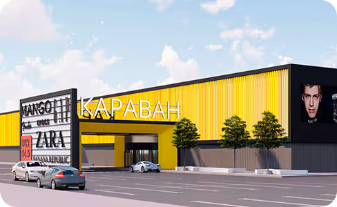 A rendering of a movie theater with cars parked in front of it.