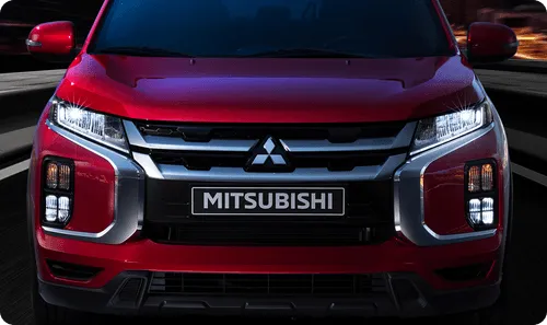 A close up of the front of a red car.