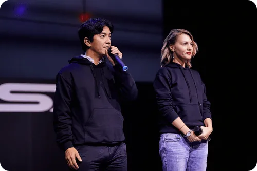 A man and a woman standing next to each other.