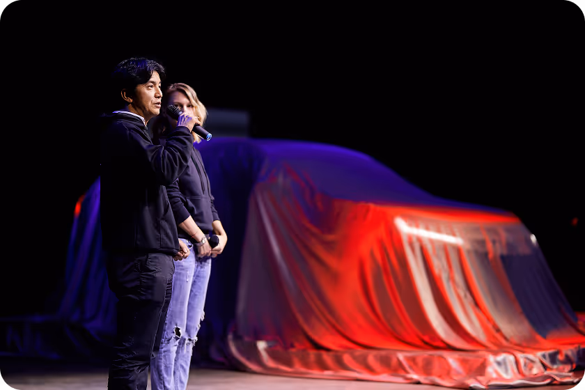 A couple of people standing on a stage.