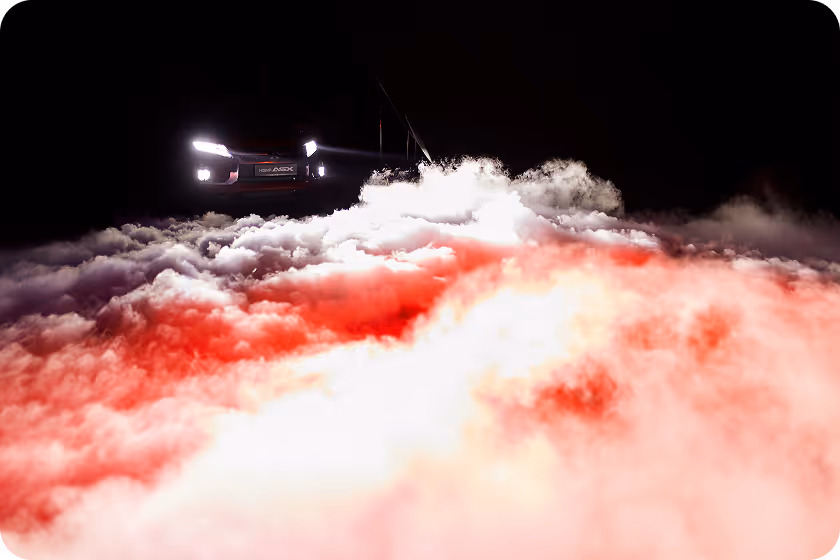 A car driving through the clouds at night.