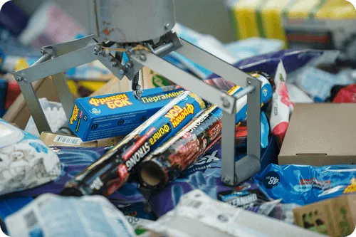 A pile of junk with a machine on top of it.