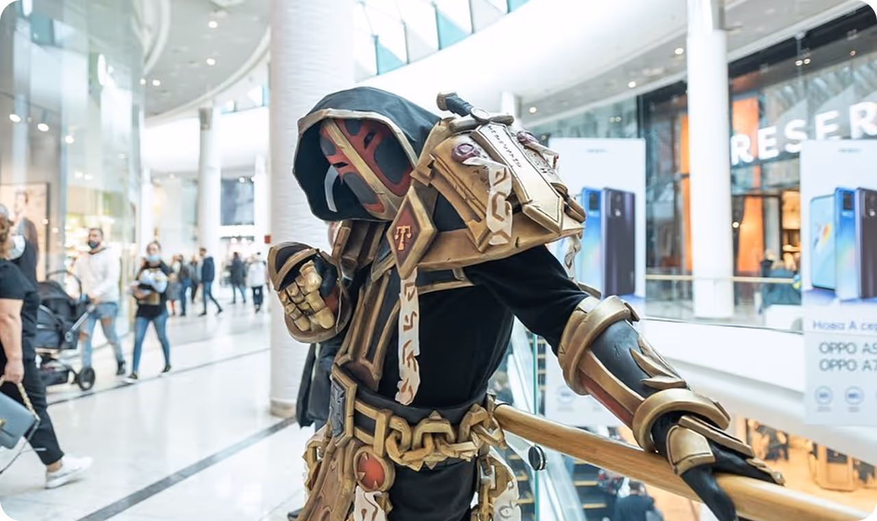 A person dressed in a costume in a mall.