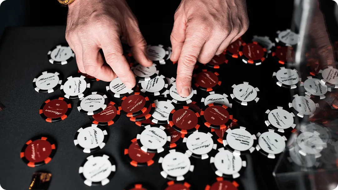 A person is playing a game of poker.