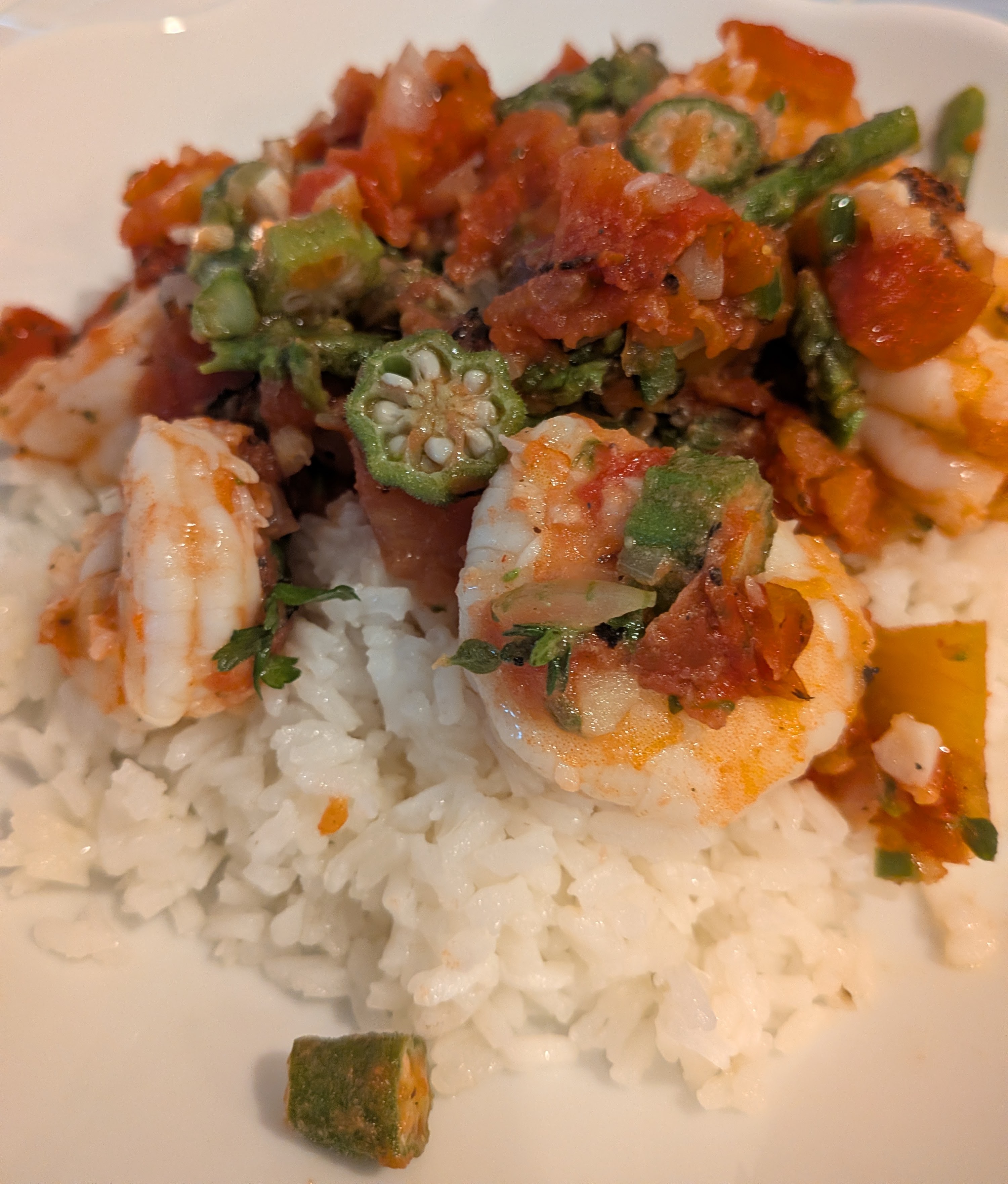 Shrimp, okra and tomatoes over rice.