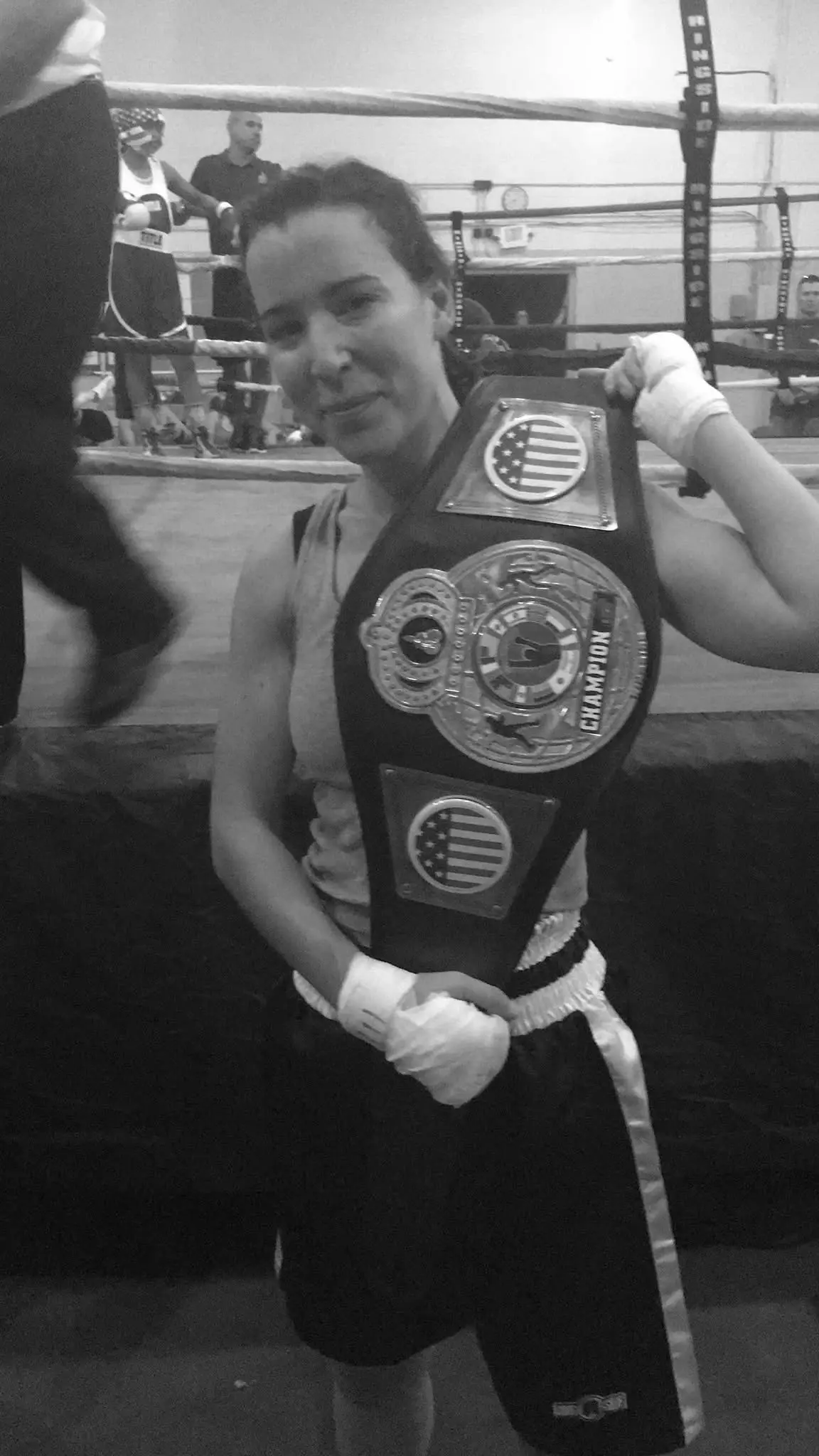 Kaitlyn holds her belt from her boxing match. These skills help us to teach women's self defense at Guardian Self Defense. 