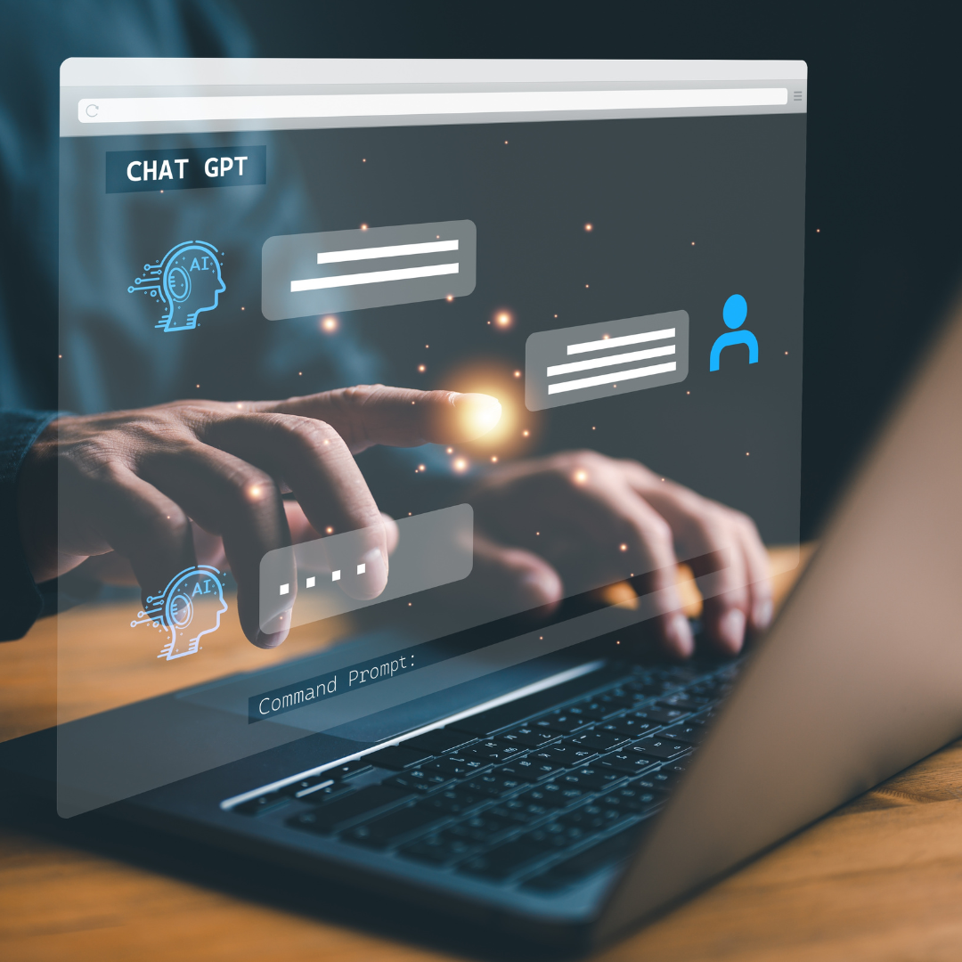  Person typing on a laptop with a holographic interface displaying AI chat bubbles labeled “CHAT GPT” and digital icons.