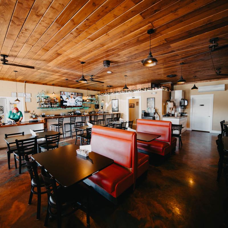Restaurant interior showcasing wooden ceilings.