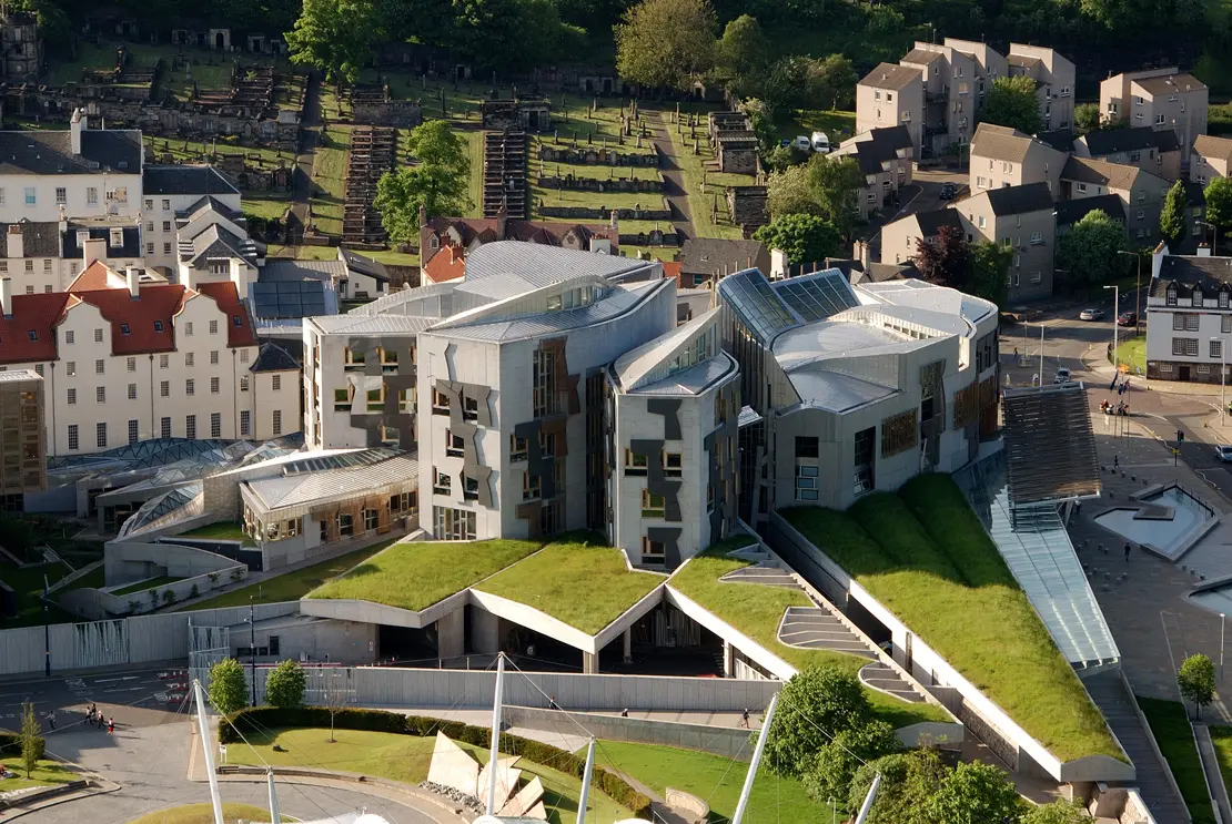 Exterior of Scottish Parliament building in Edinburgh, a hub for policy discussions on sustainability and reusables.