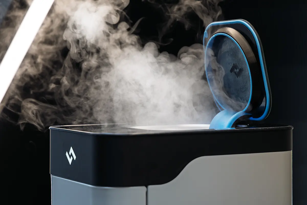 Instarinse cup cleaning machine releasing steam, highlighting eco-friendly reusable cup cleaning technology.