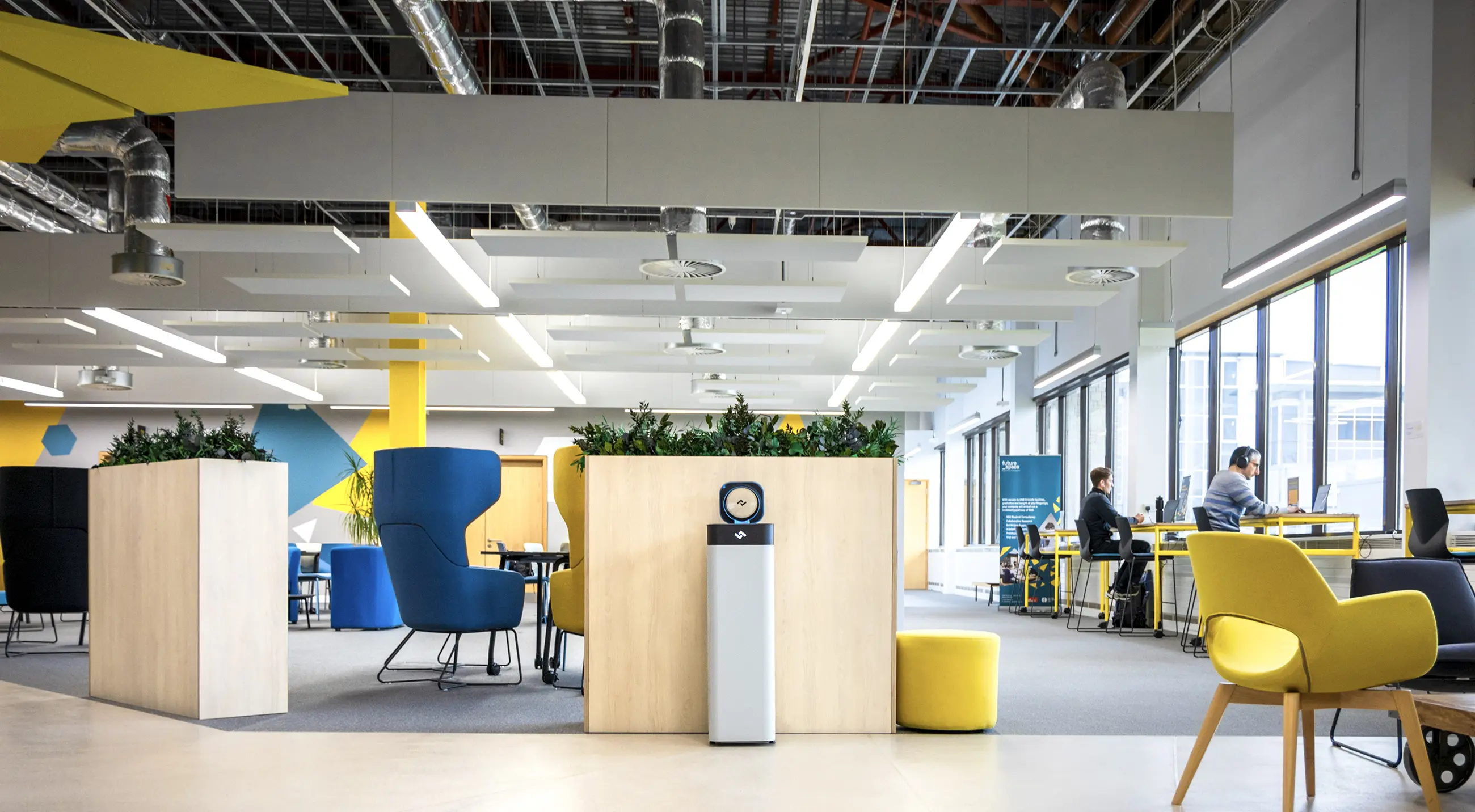 Bright workspace with an instarinse machine placed centrally to encourage reusable cup habits among staff.