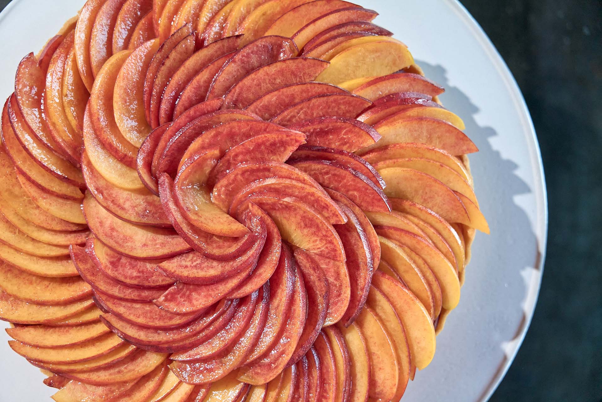 Summer peach tart dessert by chef Yann Nury