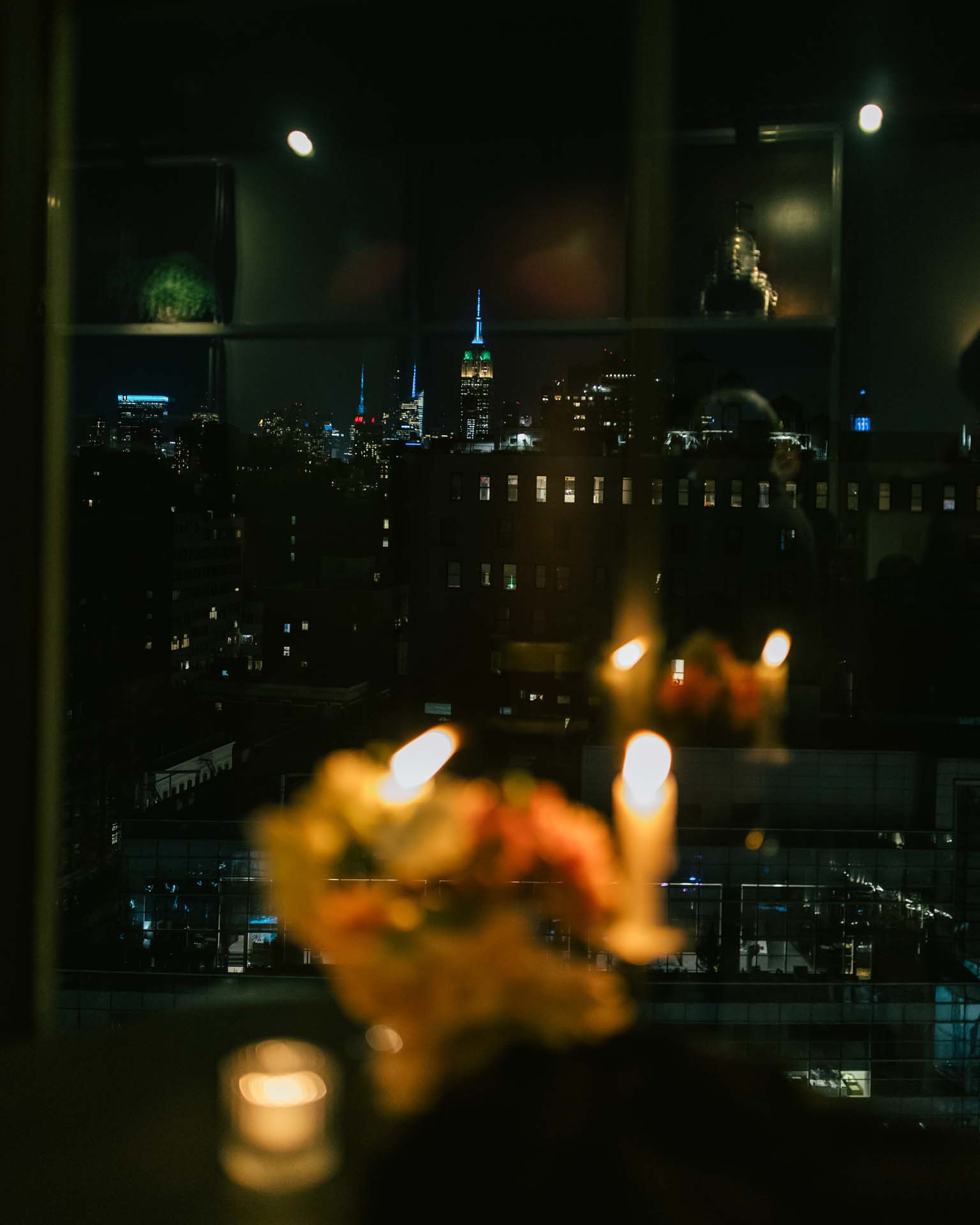 Window view of empire state building at night