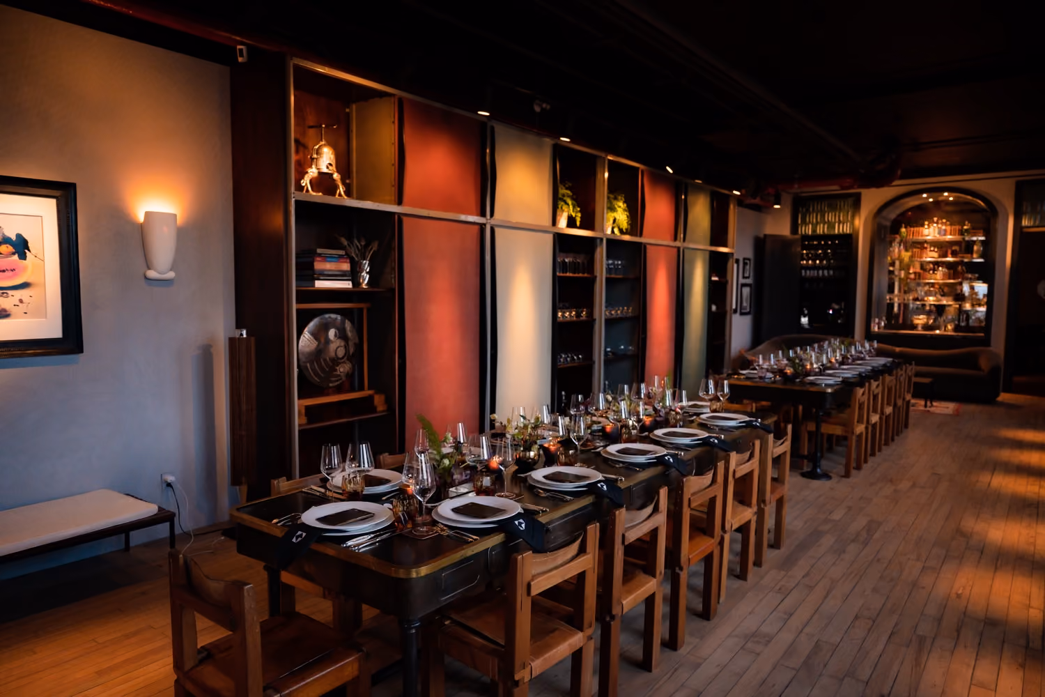 Elegant restaurant dining room with long tables set for a private event
