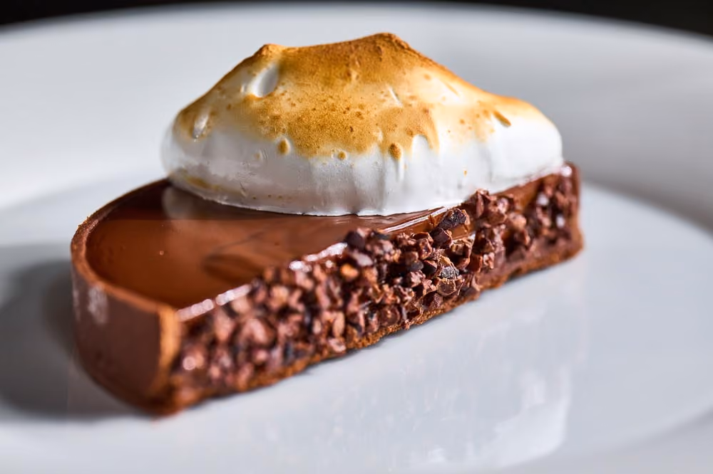 Chocolate tart topped with torched meringue