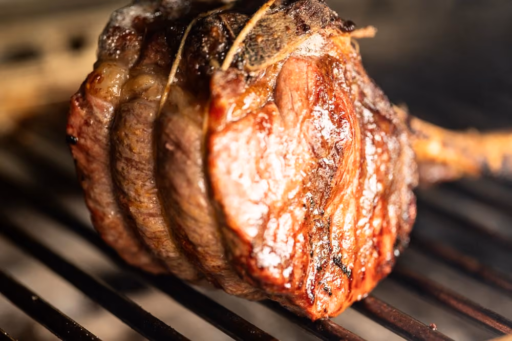 Close-up of a seared tomahawk steak on the grill