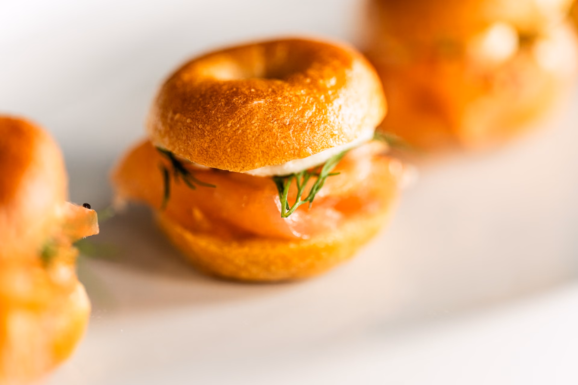 Mini bagel canapés with smoked salmon, cream cheese, and dill