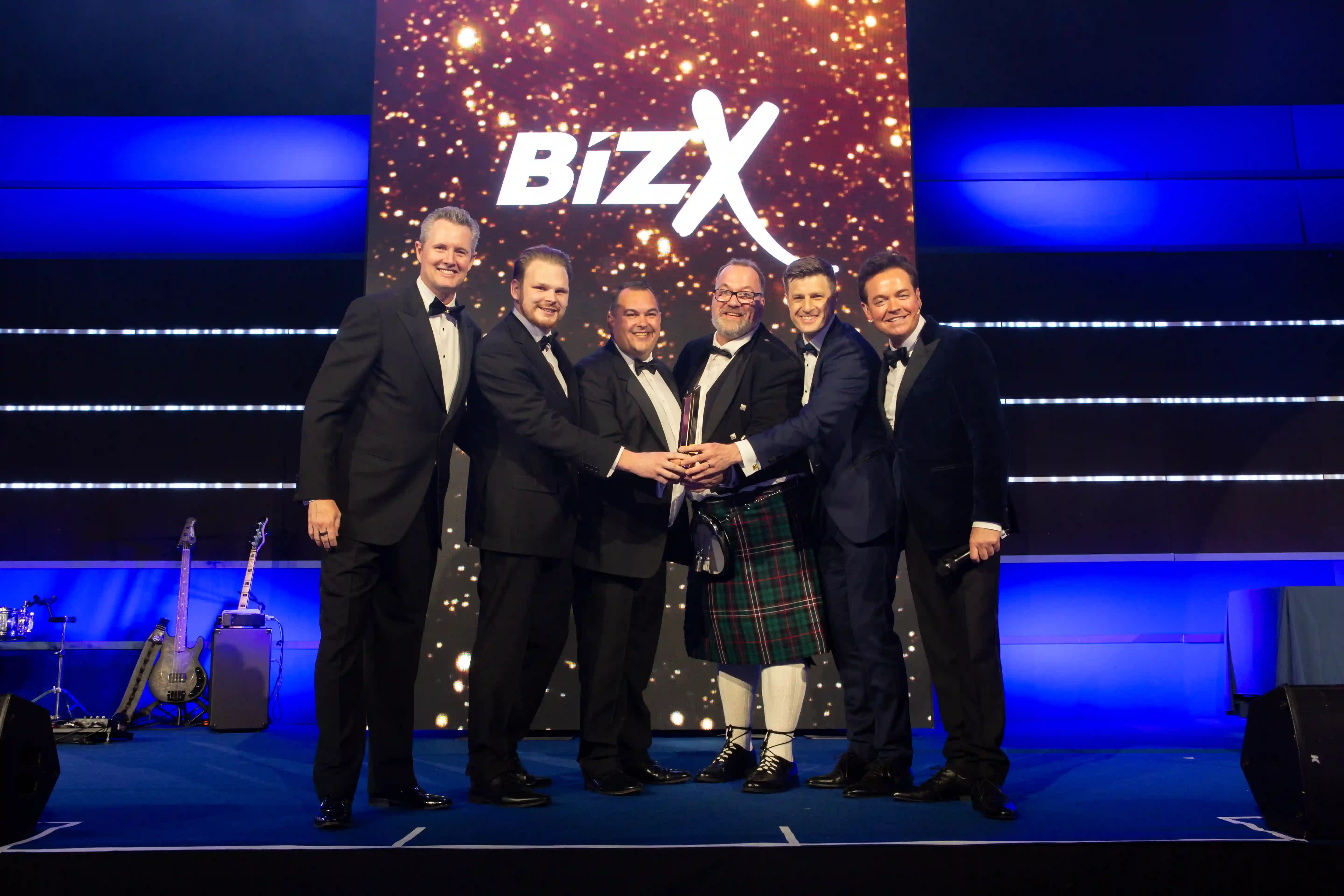 James Vincent taking a group photo at the BizX awards