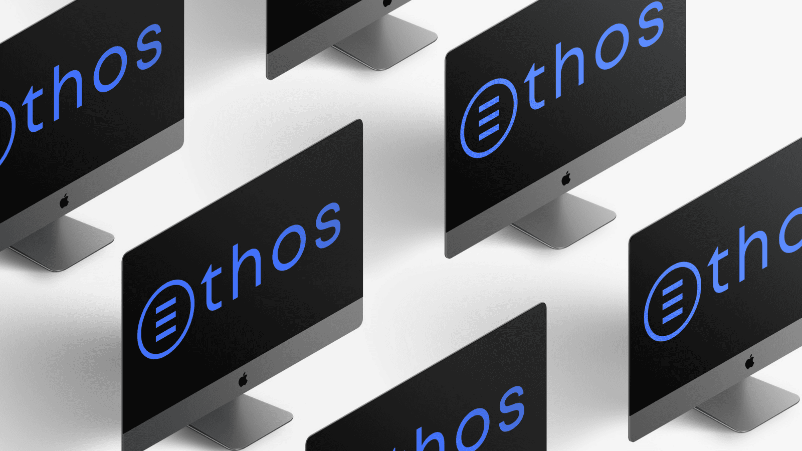 5 Mac Book Computers displaying The Ethos Team logo over a black screen.